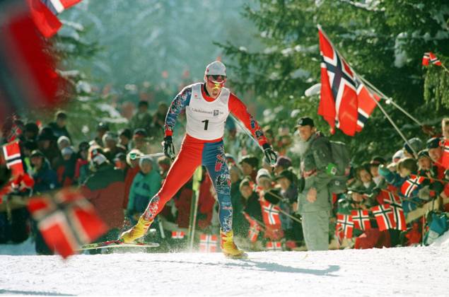 LILLEHAMMER 19940219 Olympic Cross-Country 15 km pursuit start at the Birkebeineren ski stadium Bjorn Daehlie cheers in the race Audience with Norwegian flags in the background 32000 333 Photo Gorm Kallestad, NTB archive NTB Lillehammer NORWAY NORWAY EDITORIAL USE ONLY  EDITORIAL USE ONLY. RESTRICTED USE FOR BETTING COMPANIES Ref:0240173716st.jpg