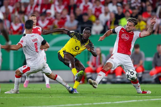 2025 08 18, Soccer, 1 round DFB Cup, Rot Weiss Essen Borussia Dortmund, Stadion Hafenstraße, Season 2025 2026 Goal shot against Klaus Gjasula Rot Weiss Essen 08 and Jose Enrique Rios Alonso Rot Weiss Essen 23 Goal to 1 0 by scorer Serhou Guirassy BVB 09 together with DFB regulations prohibit any use of photographs as image sequences and or quasi video Nordrhein Westfalen Germany
