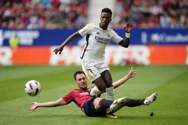 CA Osasuna v Real Madrid CF - LaLiga EA Sports PAMPLONA, SPAIN - MARCH 16: Vinicius Junior (top) left winger of Real Madrid and Brazil and Unai Garcia (ground) centre-back of Osasuna and Spain compete for the ball during the LaLiga EA Sports match between CA Osasuna and Real Madrid CF at Estadio El Sadar on March 16, 2024 in Pamplona, Spain. Spain World. Editorial use only. Please get in touch for any other usage.  Copyright: x2025xAnadoluxJosexHernandezx