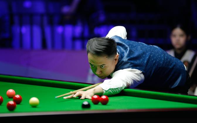 WUHAN, CHINA - AUGUST 24: Xiao Guodong of China plays a shot in the first round match against Mink Nutcharut of Thailand on day 1 of the 2025 Wuhan Open Qualifiers at Optics Valley Gymnasium of HUST on August 24, 2025 in Wuhan, Hubei Province of China.  Copyright: xTaixChengzhex 111586616983
