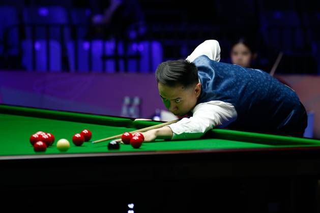 WUHAN, CHINA - AUGUST 24: Xiao Guodong of China plays a shot in the first round match against Mink Nutcharut of Thailand on day 1 of the 2025 Wuhan Open Qualifiers at Optics Valley Gymnasium of HUST on August 24, 2025 in Wuhan, Hubei Province of China.  Copyright: xTaixChengzhex 111586616979
