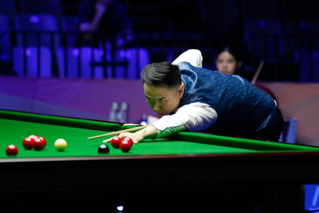 WUHAN, CHINA - AUGUST 24: Xiao Guodong of China plays a shot in the first round match against Mink Nutcharut of Thailand on day 1 of the 2025 Wuhan Open Qualifiers at Optics Valley Gymnasium of HUST on August 24, 2025 in Wuhan, Hubei Province of China.  Copyright: xTaixChengzhex 111586616980
