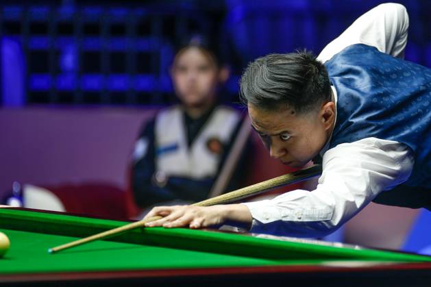 WUHAN, CHINA - AUGUST 24: Xiao Guodong of China plays a shot in the first round match against Mink Nutcharut of Thailand on day 1 of the 2025 Wuhan Open Qualifiers at Optics Valley Gymnasium of HUST on August 24, 2025 in Wuhan, Hubei Province of China.  Copyright: xTaixChengzhex 111586616984