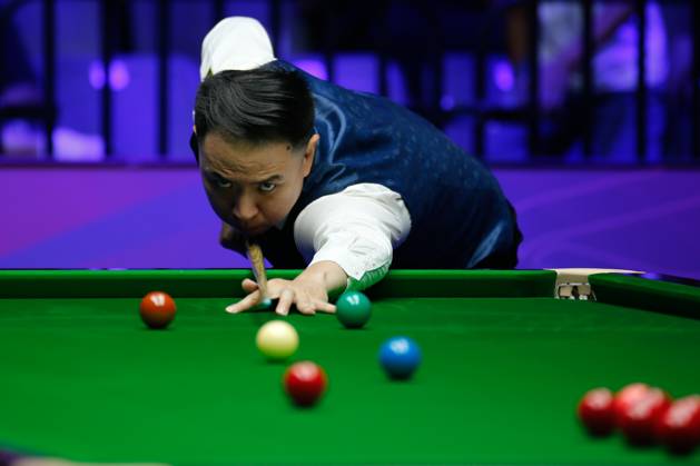 WUHAN, CHINA - AUGUST 24: Xiao Guodong of China plays a shot in the first round match against Mink Nutcharut of Thailand on day 1 of the 2025 Wuhan Open Qualifiers at Optics Valley Gymnasium of HUST on August 24, 2025 in Wuhan, Hubei Province of China.  Copyright: xTaixChengzhex 111586616987