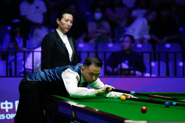 WUHAN, CHINA - AUGUST 24: Xiao Guodong of China plays a shot in the first round match against Mink Nutcharut of Thailand on day 1 of the 2025 Wuhan Open Qualifiers at Optics Valley Gymnasium of HUST on August 24, 2025 in Wuhan, Hubei Province of China.  Copyright: xTaixChengzhex 111586616973
