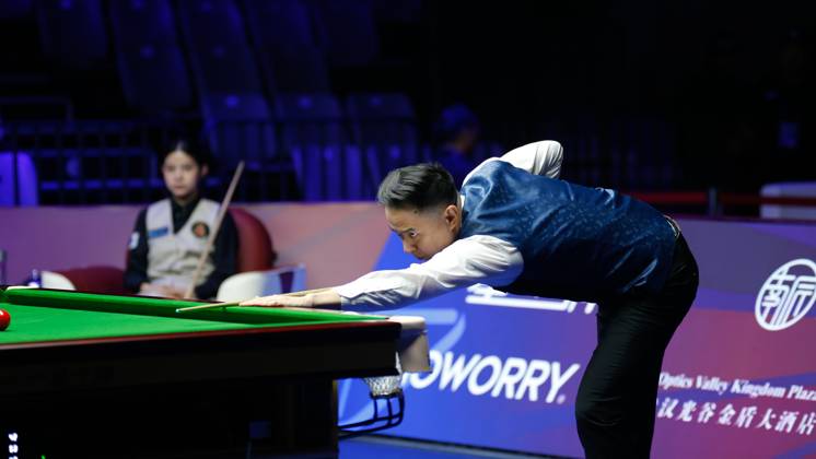 WUHAN, CHINA - AUGUST 24: Xiao Guodong of China plays a shot in the first round match against Mink Nutcharut of Thailand on day 1 of the 2025 Wuhan Open Qualifiers at Optics Valley Gymnasium of HUST on August 24, 2025 in Wuhan, Hubei Province of China.  Copyright: xTaixChengzhex 111586616978