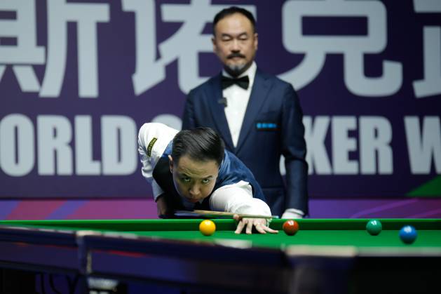WUHAN, CHINA - AUGUST 28: Xiao Guodong of China plays a shot in the Quarterfinal match against Stan Moody of England on day 5 of the 2025 Wuhan Open at Optics Valley Gymnasium of HUST on August 28, 2025 in Wuhan, Hubei Province of China.  Copyright: xTaixChengzhex 111587441727