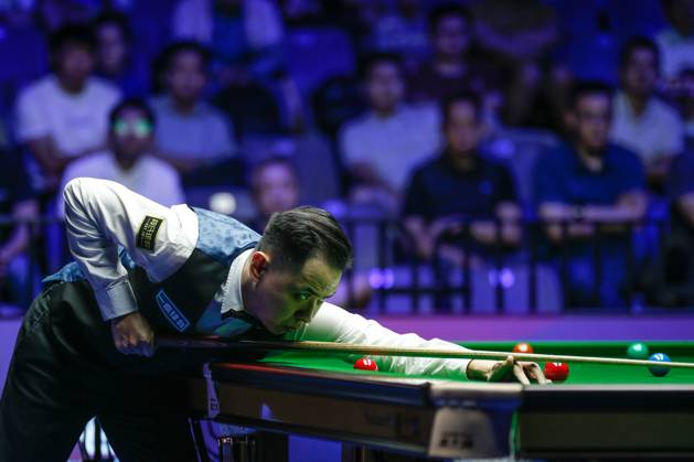 WUHAN, CHINA - AUGUST 29: Xiao Guodong of China plays a shot in the Semifinal match against Mark J Williams of Wales on day 6 of the 2025 Wuhan Open at Optics Valley Gymnasium of HUST on August 29, 2025 in Wuhan, Hubei Province of China.  Copyright: xTaixChengzhex 111587654950