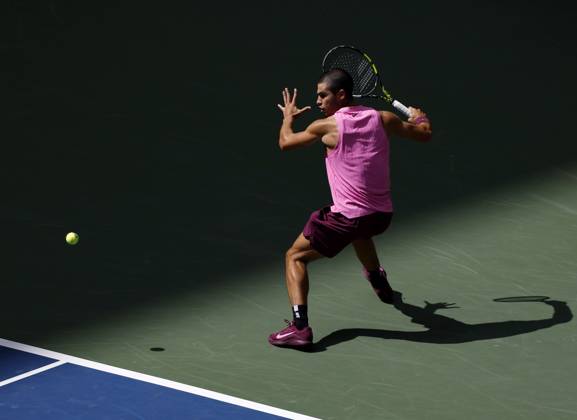 Carlos Alcaraz of Spain returns a ball to Jiri Lehecka of Czechia in the first set before defeating Lehecka in straight sets in their quarterfinal match in Arthur Ashe Stadium on day 10 at the 2025 US Open Tennis Championship at the USTA Billie Jean King National Tennis Center in New York City on Tuesday, September 2, 2025.  NYP20250902118 JOHNxANGELILLO