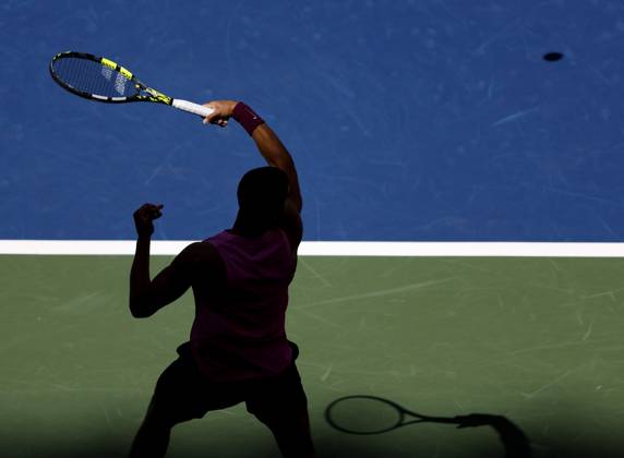 Carlos Alcaraz of Spain returns a ball to Jiri Lehecka of Czechia in the first set before defeating Lehecka in straight sets in their quarterfinal match in Arthur Ashe Stadium on day 10 at the 2025 US Open Tennis Championship at the USTA Billie Jean King National Tennis Center in New York City on Tuesday, September 2, 2025.  NYP20250902127 JOHNxANGELILLO