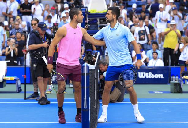 Novak Djokovic of Serbia (R) and Carlos Alcaraz of Spain greet each other before their Men s semifinal match at the 2025 US Open Tennis Championship at the USTA Billie Jean King National Tennis Center in New York City on Friday, September 5, 2025.  NYP20250905902 JOHNxANGELILLO