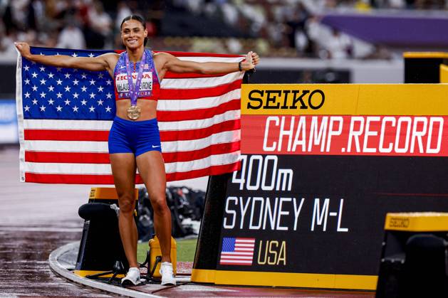 winner Sydney Mclaughlin Levrone of United States of America with a championship record and celebrating and holding flag after competing in the Women s 400 Metres Final during World Athletics Championships Tokyo 2025 of the Day 6 at Japan National Stadium on September 18, 2025 in Tokyo, Japan Photo by Marcel ter Bals DeFodi Images