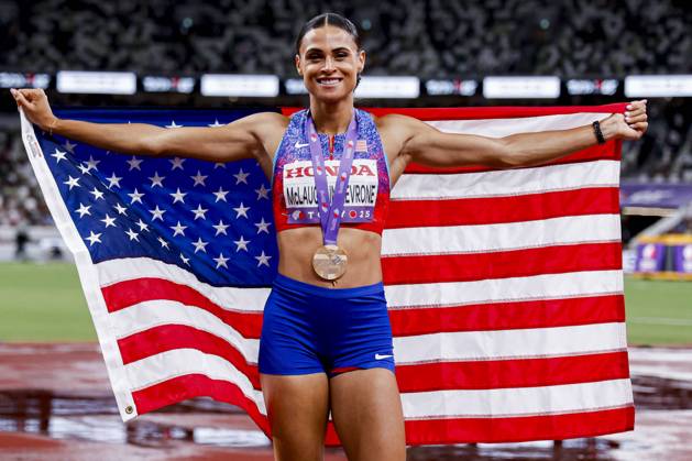 winner Sydney Mclaughlin Levrone of United States of America showing her gold medal and celebrating and holding flag after competing in the Women s 400 Metres Final during World Athletics Championships Tokyo 2025 of the Day 6 at Japan National Stadium on September 18, 2025 in Tokyo, Japan Photo by Marcel ter Bals DeFodi Images