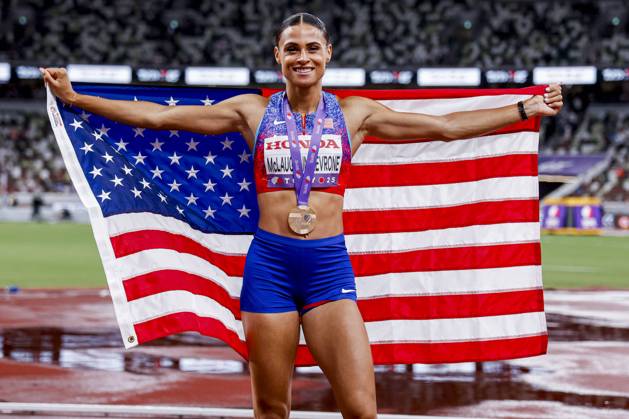 winner Sydney Mclaughlin Levrone of United States of America showing her gold medal and celebrating and holding flag after competing in the Women s 400 Metres Final during World Athletics Championships Tokyo 2025 of the Day 6 at Japan National Stadium on September 18, 2025 in Tokyo, Japan Photo by Marcel ter Bals DeFodi Images