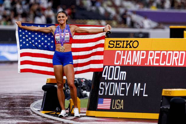 winner Sydney Mclaughlin Levrone of United States of America with a championship record and celebrating and holding flag after competing in the Women s 400 Metres Final during World Athletics Championships Tokyo 2025 of the Day 6 at Japan National Stadium on September 18, 2025 in Tokyo, Japan Photo by Marcel ter Bals DeFodi Images