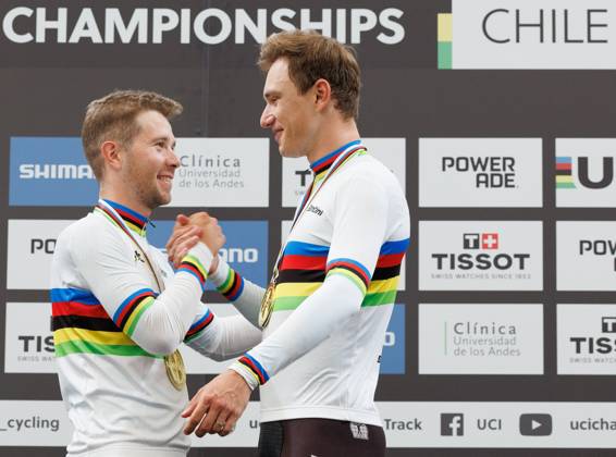 Belgian Fabio Van Den Bossche and Belgian Lindsay De Vylder celebrate on the podium after winning the podium ceremony of the men s Madison race at the 2025 UCI Track World Championships cycling, in Santiago, Chile, Sunday 26 October 2025. The Track World Championships take place from 22 to 26 October at the Velodromo de Penalolen in Santiago, Chile. BENOITxDOPPAGNE x138051499x