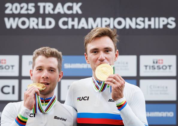 Belgian Fabio Van Den Bossche and Belgian Lindsay De Vylder celebrate on the podium after winning the podium ceremony of the men s Madison race at the 2025 UCI Track World Championships cycling, in Santiago, Chile, Sunday 26 October 2025. The Track World Championships take place from 22 to 26 October at the Velodromo de Penalolen in Santiago, Chile. BENOITxDOPPAGNE x138056436x