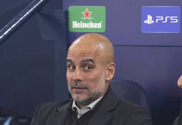 Manchester, England, 5th November 2025. Pep Guardiola coach of Manchester City takes his seat in the dugout during the Manchester City vs Borussia Dortmund UEFA Champions League match at the Etihad Stadium, Manchester. Picture credit should read: Andrew Yates Sportimage EDITORIAL USE ONLY. No use with unauthorised audio, video, data, fixture lists, club league logos or live services. Online in-match use limited to 120 images, no video emulation. No use in betting, games or single club league player publications. SPI_015_AY_Man_City_Dortmund SPI-4268-0026