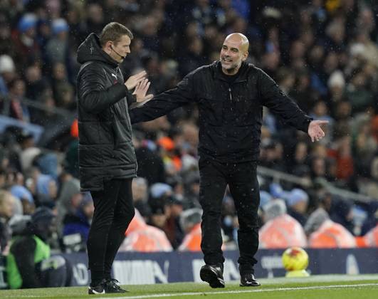 Manchester, England, 9th November 2025. Pep Guardiola coach of Manchester City questions the fourth official during the Manchester City vs Liverpool Premier League match at the Etihad Stadium, Manchester. Picture credit should read: Andrew Yates Sportimage EDITORIAL USE ONLY. No use with unauthorised audio, video, data, fixture lists, club league logos or live services. Online in-match use limited to 120 images, no video emulation. No use in betting, games or single club league player publications. SPI_055_AY_Man_City_Liverpool SPI-4280-0055