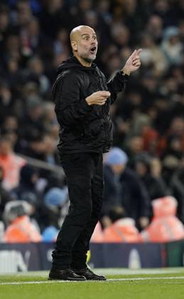 Manchester, England, 9th November 2025. Pep Guardiola coach of Manchester City sends out instructions during the Manchester City vs Liverpool Premier League match at the Etihad Stadium, Manchester. Picture credit should read: Andrew Yates Sportimage EDITORIAL USE ONLY. No use with unauthorised audio, video, data, fixture lists, club league logos or live services. Online in-match use limited to 120 images, no video emulation. No use in betting, games or single club league player publications. SPI_082_AY_Man_City_Liverpool SPI-4280-0078