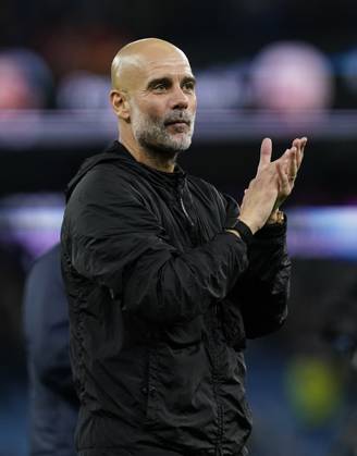 Manchester, England, 9th November 2025. Pep Guardiola coach of Manchester City applauds the fans during the Manchester City vs Liverpool Premier League match at the Etihad Stadium, Manchester. Picture credit should read: Andrew Yates Sportimage EDITORIAL USE ONLY. No use with unauthorised audio, video, data, fixture lists, club league logos or live services. Online in-match use limited to 120 images, no video emulation. No use in betting, games or single club league player publications. SPI_089_AY_Man_City_Liverpool SPI-4280-0085