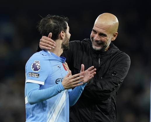 Manchester, England, 9th November 2025. Pep Guardiola coach of Manchester City and Bernardo Silva of Manchester City during the Manchester City vs Liverpool Premier League match at the Etihad Stadium, Manchester. Picture credit should read: Andrew Yates Sportimage EDITORIAL USE ONLY. No use with unauthorised audio, video, data, fixture lists, club league logos or live services. Online in-match use limited to 120 images, no video emulation. No use in betting, games or single club league player publications. SPI_090_AY_Man_City_Liverpool SPI-4280-0087