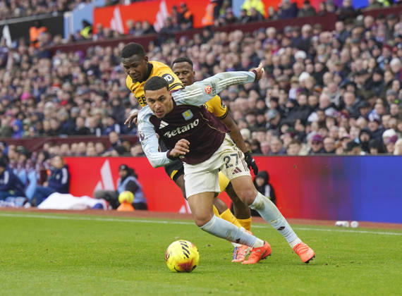 Birmingham, England, 30th November 2025. Morgan Rogers of Aston Villa moves ahead of Yerson Mosquera of Wolverhampton Wanderers during the Aston Villa vs Wolverhampton Wanderers Premier League match at Villa Park, Birmingham. Picture credit should read: Andrew Yates Sportimage EDITORIAL USE ONLY. No use with unauthorised audio, video, data, fixture lists, club league logos or live services. Online in-match use limited to 120 images, no video emulation. No use in betting, games or single club league player publications. SPI_020_AY_Villa_Wolves SPI-4336-0020