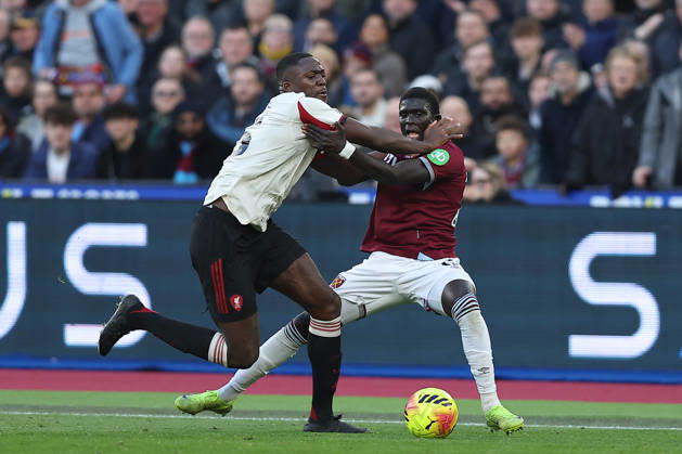 30th November 2025; London Stadium, London, England; Premier League Football, West Ham United versus Liverpool; Ibrahima Konate of Liverpool and El Hadji Malick Diouf of West Ham United hold onto each other while competing for the ball with Ibrahima Konate winning out to the displeasure of West Ham United fans that no foul is given  KatiexChan