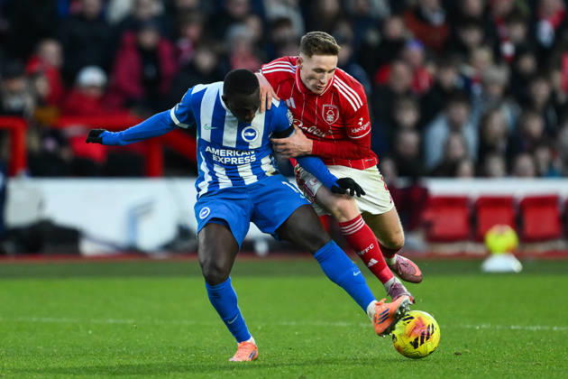 Nottingham, England, 30th November 2025. Yankuba Minteh of Brighton is tackled by Elliot Anderson of Nottingham Forest during the Nottingham Forest vs Brighton and Hove Albion Premier League match at the City Ground, Nottingham. Picture credit should read: Craig Thomas Sportimage EDITORIAL USE ONLY. No use with unauthorised audio, video, data, fixture lists, club league logos or live services. Online in-match use limited to 120 images, no video emulation. No use in betting, games or single club league player publications. SPI_055_CT_Nottingham_Forest_vs_Brighton_and_Hove_Albion SPI-4337-0066