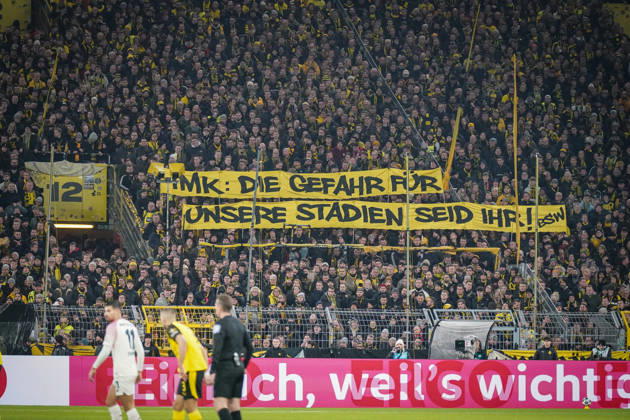 Germany Football DFB Cup 2025 26, Round of 16 Borussia Dortmund vs Bayer 04 Leverkusen Signal Iduna Park Dortmund Large protest banner of BVB fans IMK The danger for our stadiums is you Topics Conference of Interior Ministers, stadium security, fan protests, fan culture, political debate, security policy, transparency, soccer society, Bundesliga, home match crowd, emotional south stand, expression of opinion, public discussion, sports politics, social tensions Dortmund North Rhine-Westphalia Germany Copyright: xJOERANxSTEINSIEKx