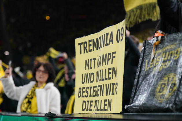 Germany Football DFB Cup 2025 26, Round of 16 Borussia Dortmund vs Bayer 04 Leverkusen Signal Iduna Park Dortmund BVB fans with handmade yellow poster Tremonia 09 With fight and will we defeat the pills, emotional fan culture, derby rivalry, Bayer Leverkusen pills, support of the team, Bundesliga, stadium atmosphere, fan block, passion, club identity, soccer tradition, spectator emotions, media attention Dortmund North Rhine-Westphalia Germany Copyright: xJOERANxSTEINSIEKx