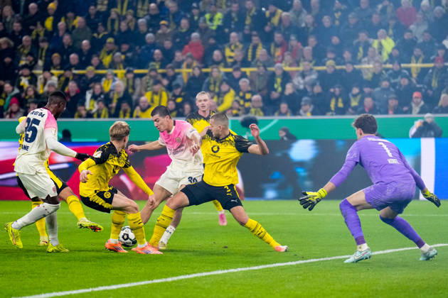DORTMUND, GERMANY - DECEMBER 2: Ibrahim Maza of Bayer 04 Leverkusen shoots to score his team s first goal past Borussia Dortmund goalkeeper Gregor Kobel during the DFB Cup round of 16 match between Borussia Dortmund and Bayer 04 Leverkusen at Signal Iduna Park on December 2, 2025 in Dortmund, Germany. (Photo by Rene Nijhuis) SPO  Copyright: xRenexNijhuis