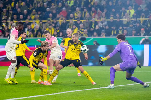 DORTMUND, GERMANY - DECEMBER 2: Ibrahim Maza of Bayer 04 Leverkusen shoots to score his team s first goal past Borussia Dortmund goalkeeper Gregor Kobel during the DFB Cup round of 16 match between Borussia Dortmund and Bayer 04 Leverkusen at Signal Iduna Park on December 2, 2025 in Dortmund, Germany. (Photo by Rene Nijhuis) SPO  Copyright: xRenexNijhuis