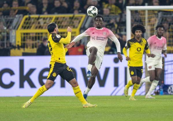 duel between Ernest POKU Bayer 04 Leverkusen, 19 and Emre CAN Borussia Dortmund, 23 Borussia Dortmund Bayer Leverkusen, DFB Pokal Round of 16 in Dortmund, Signal Iduna Park DFL regulations prohibit any use of photographs as image sequences and or quasi video Copyright: HMBxMedia xMarcoxBader