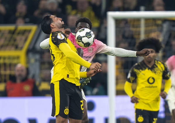 duel between Ernest POKU Bayer 04 Leverkusen, 19 and Emre CAN Borussia Dortmund, 23 Borussia Dortmund Bayer Leverkusen, DFB Pokal Round of 16 in Dortmund, Signal Iduna Park DFL regulations prohibit any use of photographs as image sequences and or quasi video Copyright: HMBxMedia xMarcoxBader