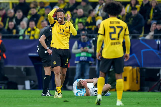 10 12 2025, Football, UEFA Champions League, Borussia Dortmund FK Bodö Glimt, BVB Stadion, Matchday 5, Season 2025 2026 Felix Nmecha BVB 08 gesticulating on the pitch next to Ulrik Saltnes Bodo Glimt lying on the ground 14 Regulations prohibit any use of photographs as image sequences and or quasi video North Rhine-Westphalia Germany