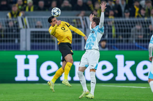 10 12 2025, Football, UEFA Champions League, Borussia Dortmund FK Bodö Glimt, BVB Stadion, Matchday 5, Season 2025 2026 Ramy Bensebaini BVB 05 header in duel against Andreas Helmersen Bodo Glimt 21 Regulations prohibit any use of photographs as image sequences and or quasi video North Rhine-Westphalia Germany
