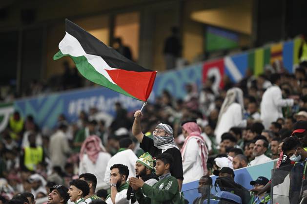 Palestine v Saudi Arabia - 2025 FIFA Arab Cup LUSAIL, QATAR – DECEMBER 11: Supporter of Palestine waves the Palestinian flag during their 2025 FIFA Arab Cup quarterfinal match between Palestine and Saudi Arabia at Lusail Stadium in Lusail, Qatar on December 11, 2025. Stringer Anadolu Lusail Qatar. Editorial use only. Please get in touch for any other usage.  Copyright: x2025xAnadoluxStringerx