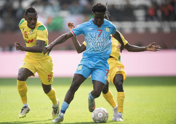 Congo DR v Benin: Group D - Africa Cup Of Nations RABAT, MOROCCO - DECEMBER 23: Nathanael Mbuku of Congo DR (centre) holds off Rachid Moumini and Sessi D Almeida of Benin (left) and during the Africa Cup Of Nations Group D match between Congo DR and Benin at on December 23, 2025 in Rabat, Morocco. Rabat Morocco Copyright: xVisionhausx 776422241