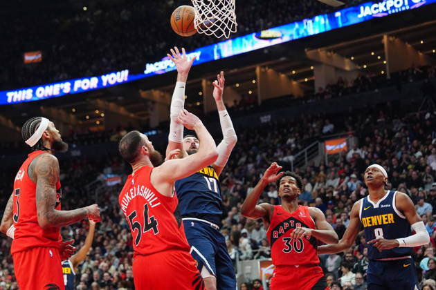 December 31, 2025, Toronto, On, CANADA: Denver Nuggets centre Jonas ValanÄÂiAÂ«nas (17) shoots over Toronto Raptors Sandro Mamukelashvili (54) during first half NBA, Basketball Herren, USA action in Toronto on Wednesday December 31, 2025. Canada News - December 31, 2025  - ZUMAc35_ 20251231_zaf_c35_053 Copyright: xFrankxGunnx
