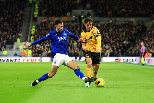 Liverpool, England, 7th January 2026. Hugo Bueno of Wolverhampton Wanderers is challenged by Dwight McNeil of Everton during the Everton vs Wolverhampton Wanderers Premier League match at Hill Dickinson Stadium, Liverpool. Picture credit should read: Jessica Hornby Sportimage EDITORIAL USE ONLY. No use with unauthorised audio, video, data, fixture lists, club league logos or live services. Online in-match use limited to 120 images, no video emulation. No use in betting, games or single club league player publications. SPI_061_JH_EVERTON_WOLVES SPI-4436-0058