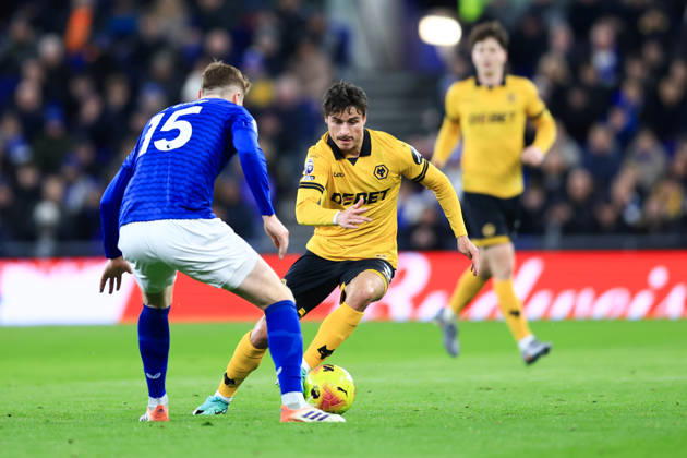 Liverpool, England, 7th January 2026. Hugo Bueno of Wolverhampton Wanderers runs with the ball whilst under pressure from Jake O™Brien of Everton during the Everton vs Wolverhampton Wanderers Premier League match at Hill Dickinson Stadium, Liverpool. Picture credit should read: Jessica Hornby Sportimage EDITORIAL USE ONLY. No use with unauthorised audio, video, data, fixture lists, club league logos or live services. Online in-match use limited to 120 images, no video emulation. No use in betting, games or single club league player publications. SPI_064_JH_EVERTON_WOLVES SPI-4436-0061