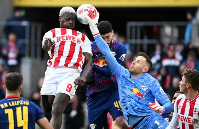 Football, Bundesliga, Germany, Men, Season 2025 2026, Matchday 21, Rhein Energie Stadion Köln, 1 FC Köln RB Leipzig Peter Gulacsi RBL , Ragnar Ache KOE , Romulo RBL Action