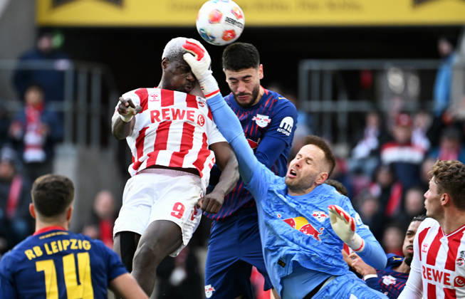Football, Bundesliga, Germany, Men, Season 2025 2026, Matchday 21, Rhein Energie Stadion Köln, 1 FC Köln RB Leipzig Peter Gulacsi RBL , Ragnar Ache KOE , Romulo RBL Action