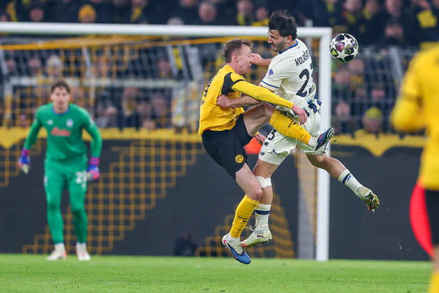 17 02 2026, Football, UEFA Champions League, Borussia Dortmund Atalanta Bergamo, BVB Stadion, Play Offs first leg, Season 2025 2026 Maximilian Beier BVB 14 in duel against Sead Kolasinac Atalanta Bergamo 23 Regulations prohibit any use of photographs as image sequences and or quasi video North Rhine-Westphalia Germany