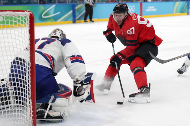 Milano Cortina 2026, Milan, Italy, 22.02, 2026, MiCo2026, MiCo, 2026, Olympics, Olympic, Winter Olympic, Olympic Winter games, Winterspiele,Spiele, Summer games Ice hockey, Eishockey hockey, USA, Canada, final Connor Hellebuyck of United States and Connor McDavid of Canada in action during Ice Hockey final game between Canada and United States of Milano Cortina 2026 Olympic Winter Games in Milan, Italy, 22.02.2026. Photo: Roman Koksarov (RKF) Milan Italy Copyright: xRomanxKoksarovx 0B4A0391