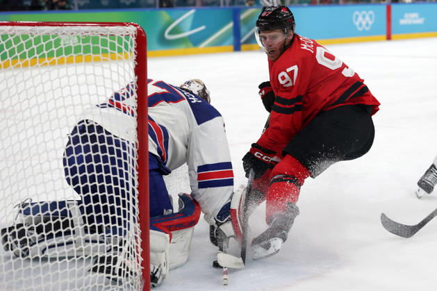 Milano Cortina 2026, Milan, Italy, 22.02, 2026, MiCo2026, MiCo, 2026, Olympics, Olympic, Winter Olympic, Olympic Winter games, Winterspiele,Spiele, Summer games Ice hockey, Eishockey hockey, USA, Canada, final Connor Hellebuyck of United States and Connor McDavid of Canada in action during Ice Hockey final game between Canada and United States of Milano Cortina 2026 Olympic Winter Games in Milan, Italy, 22.02.2026. Photo: Roman Koksarov (RKF) Milan Italy Copyright: xRomanxKoksarovx 0B4A0391