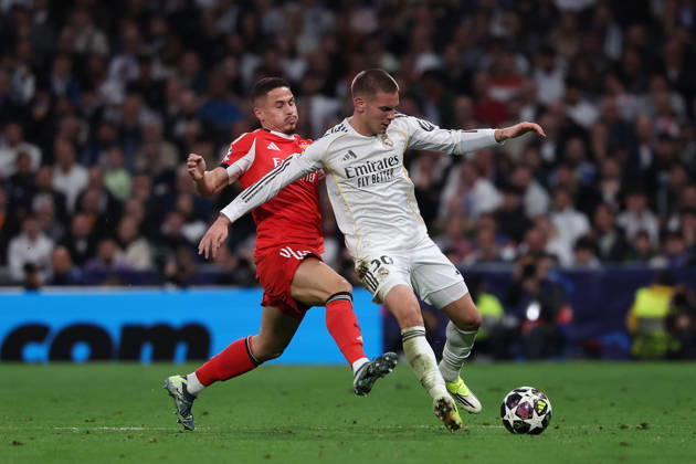 Madrid, Spain February 25, 2026 FBL UEFA Champions League 2025 26 Real Madrid SL Benfica Franjo Ivanovic S L Benfica , Franco Mastantuono Real Madrid battles for the Ball during the UEFA Champions League 2025 26 knockout play offs match between Real Madrid and SL Benfica at the Santiago Bernabà u Stadium on February 25, 2026 in Madrid, Spain Copyright: JoaquimxFerreira