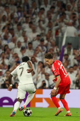 Madrid, Spain February 25, 2026 FBL UEFA Champions League 2025 26 Real Madrid SL Benfica Vinicius Junior Real Madrid , Amar Dedic S L Benfica in action, with the ball during the UEFA Champions League 2025 26 knockout play offs match between Real Madrid and SL Benfica at the Santiago Bernabà u Stadium on February 25, 2026 in Madrid, Spain Copyright: JoaquimxFerreira