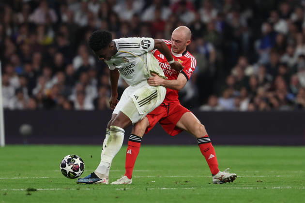 Madrid, Spain February 25, 2026 FBL UEFA Champions League 2025 26 Real Madrid SL Benfica Aurelien Tchouameni Real Madrid , Frederik Aursnes S L Benfica battles for the Ball during the UEFA Champions League 2025 26 knockout play offs match between Real Madrid and SL Benfica at the Santiago Bernabà u Stadium on February 25, 2026 in Madrid, Spain Copyright: JoaquimxFerreira